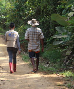 A member of the JRS LAC team walks with a beneficiary