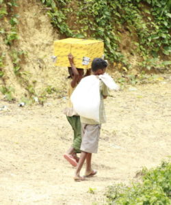 Two Rohingya children walk in the Kutupalong camp in Cox's Bazar, Bangladesh