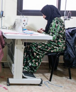Displaced women attending a sewing class in Lebanon